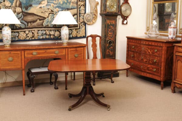 English 19th Century Plum Pudding Mahogany Rectangular Breakfast Table with Ebonized Inlay and Pedestal Base and 4 Splayed Legs on Brass Castor Feet - Image 13