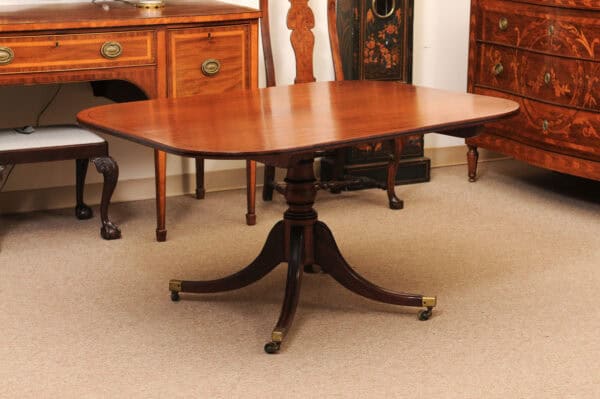English 19th Century Plum Pudding Mahogany Rectangular Breakfast Table with Ebonized Inlay and Pedestal Base and 4 Splayed Legs on Brass Castor Feet - Image 14