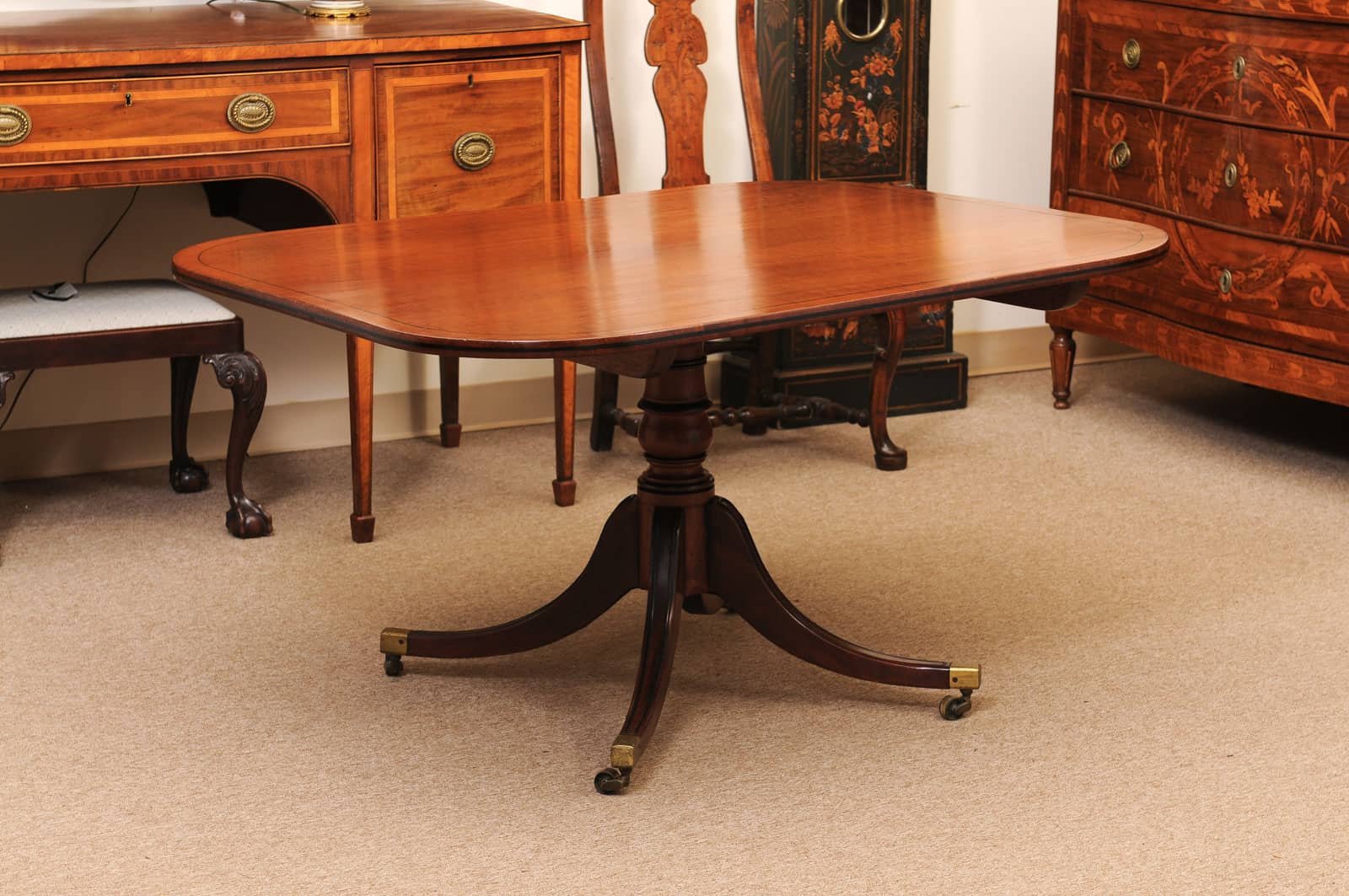 English 19th Century Plum Pudding Mahogany Rectangular Breakfast Table with Ebonized Inlay and Pedestal Base and 4 Splayed Legs on Brass Castor Feet - Image 14