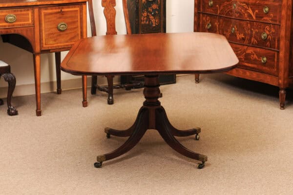 English 19th Century Plum Pudding Mahogany Rectangular Breakfast Table with Ebonized Inlay and Pedestal Base and 4 Splayed Legs on Brass Castor Feet - Image 15