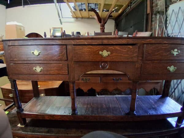 Late 18th Century English Oak Dresser Base with 5 Drawers, Arched Detail and Pot Board Below
