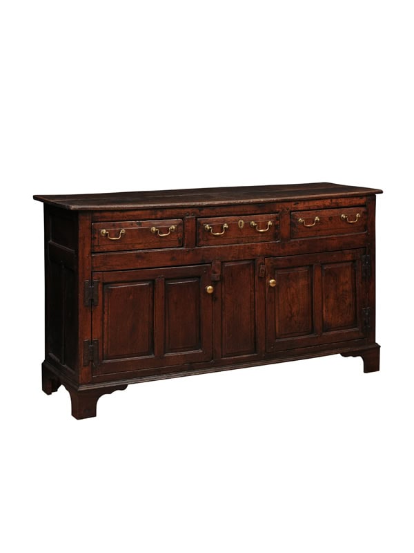 English 18th Century Oak Dresser Base Featuring 3 Drawers and 2 Flanking Cabints Below with Raised Paneled Doors and Brass Knobs