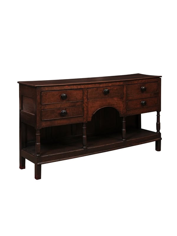 English Early 19th Century Oak Dresser Base / Server Featuring 5 Drawers with Wooden Knobs, Arched Frieze and Pot Board Below