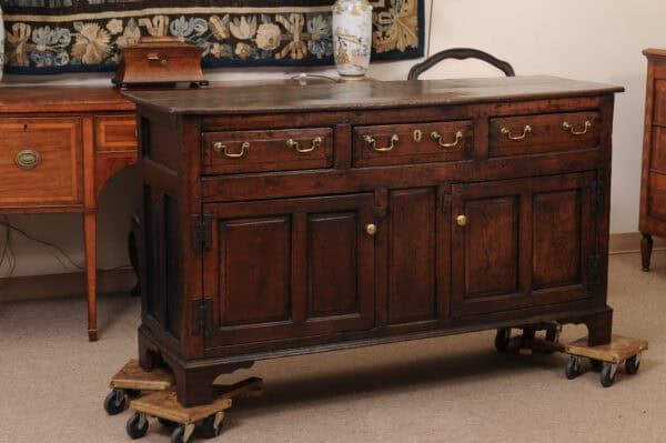 English 18th Century Oak Dresser Base Featuring 3 Drawers and 2 Flanking Cabints Below with Raised Paneled Doors and Brass Knobs - Image 3