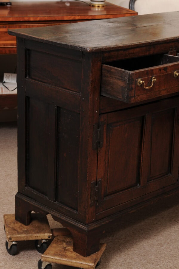 English 18th Century Oak Dresser Base Featuring 3 Drawers and 2 Flanking Cabints Below with Raised Paneled Doors and Brass Knobs - Image 5