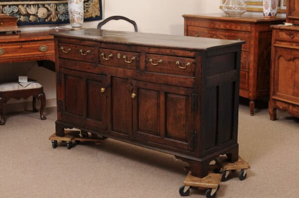 English 18th Century Oak Dresser Base Featuring 3 Drawers and 2 Flanking Cabints Below with Raised Paneled Doors and Brass Knobs - Image 12