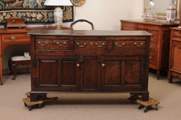 English 18th Century Oak Dresser Base Featuring 3 Drawers and 2 Flanking Cabints Below with Raised Paneled Doors and Brass Knobs - Image 13