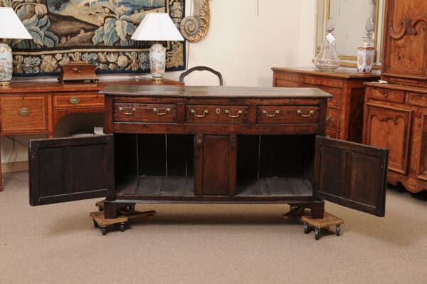 English 18th Century Oak Dresser Base Featuring 3 Drawers and 2 Flanking Cabints Below with Raised Paneled Doors and Brass Knobs - Image 14