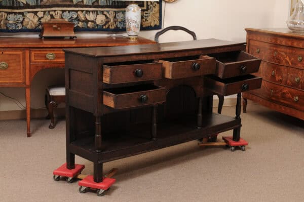 English Early 19th Century Oak Dresser Base / Server Featuring 5 Drawers with Wooden Knobs, Arched Frieze and Pot Board Below - Image 4