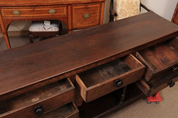 English Early 19th Century Oak Dresser Base / Server Featuring 5 Drawers with Wooden Knobs, Arched Frieze and Pot Board Below - Image 6