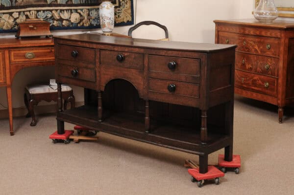 English Early 19th Century Oak Dresser Base / Server Featuring 5 Drawers with Wooden Knobs, Arched Frieze and Pot Board Below - Image 12