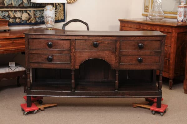 English Early 19th Century Oak Dresser Base / Server Featuring 5 Drawers with Wooden Knobs, Arched Frieze and Pot Board Below - Image 13