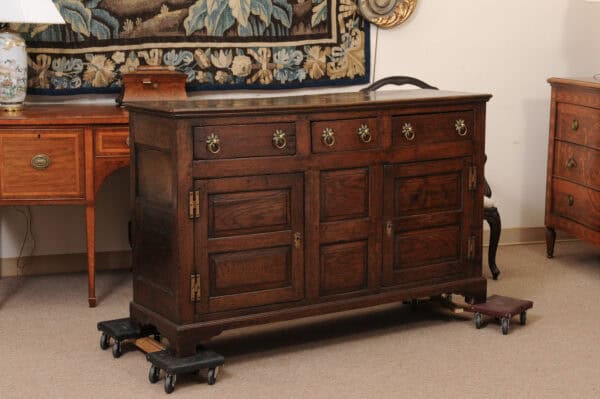 English 18th Century Dresser Base Featuring 3 Drawers with Foliage Brass Pulls and Flanking Cabinets Below - Image 3