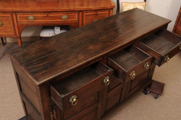 English 18th Century Dresser Base Featuring 3 Drawers with Foliage Brass Pulls and Flanking Cabinets Below - Image 5