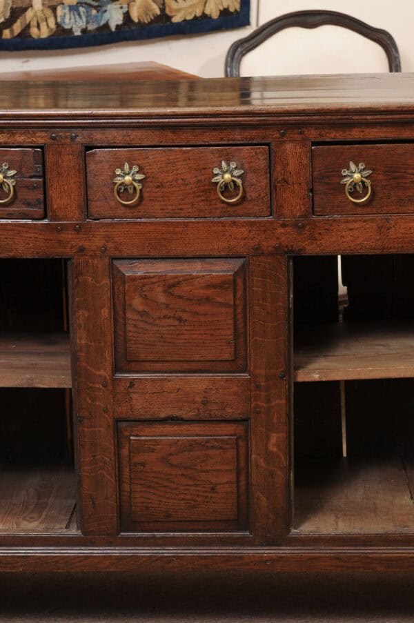 English 18th Century Dresser Base Featuring 3 Drawers with Foliage Brass Pulls and Flanking Cabinets Below - Image 15